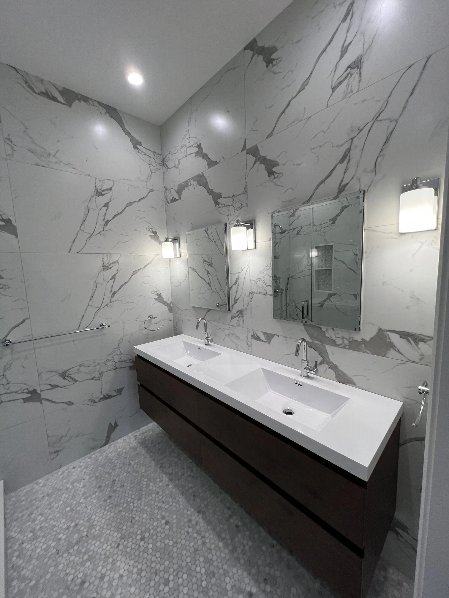 Bathroom large format porcelain tile wall and marble mosaic floor